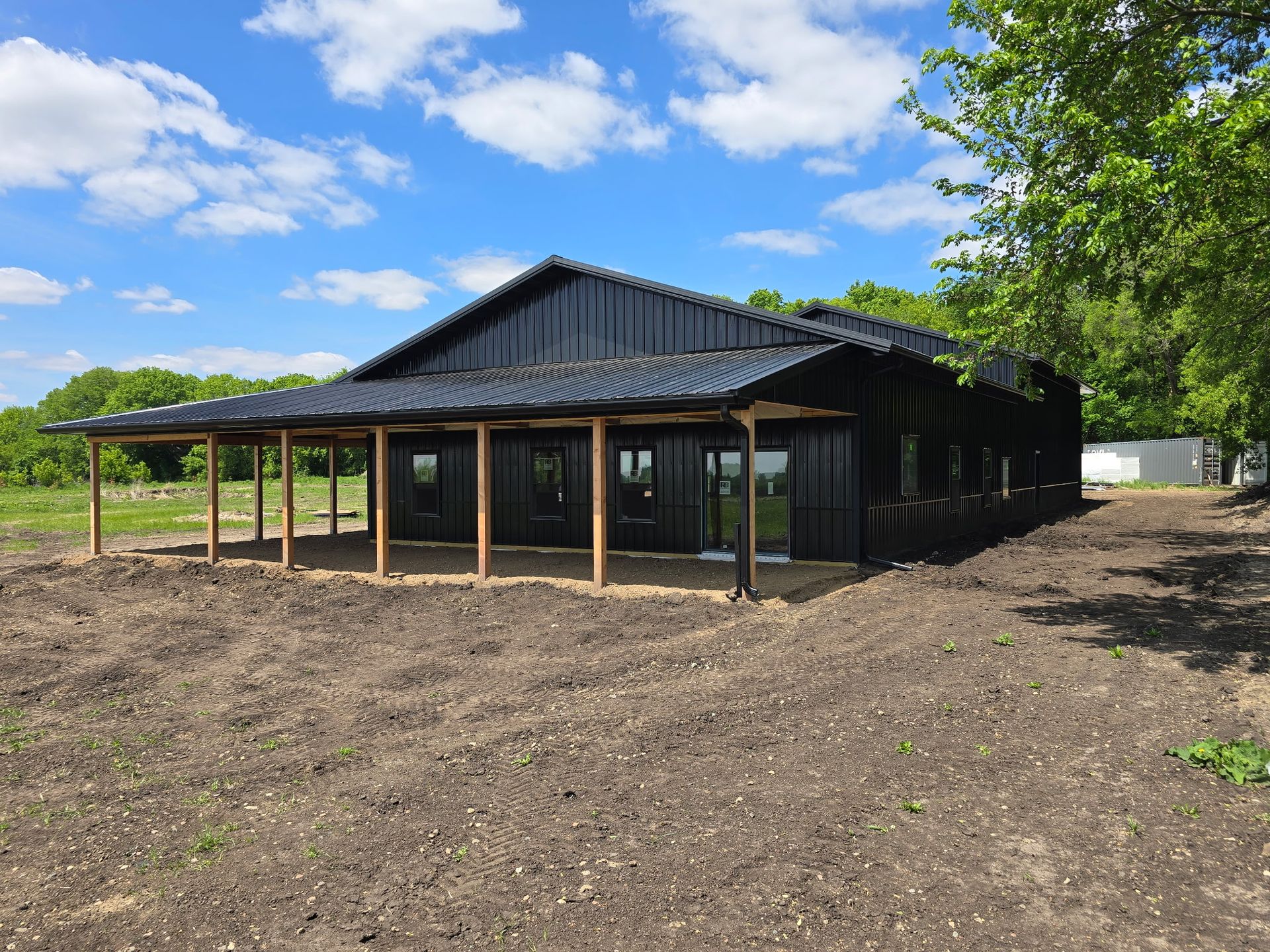 Finished Orton pole barn with porch overlooking the property